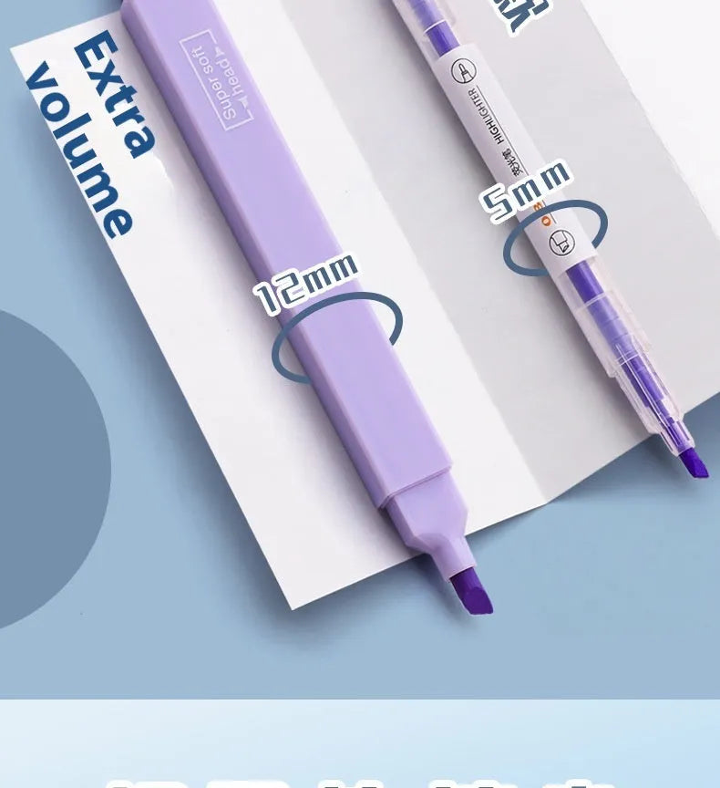 Set of double-headed fluorescent marking pens in bright colours on a white background.