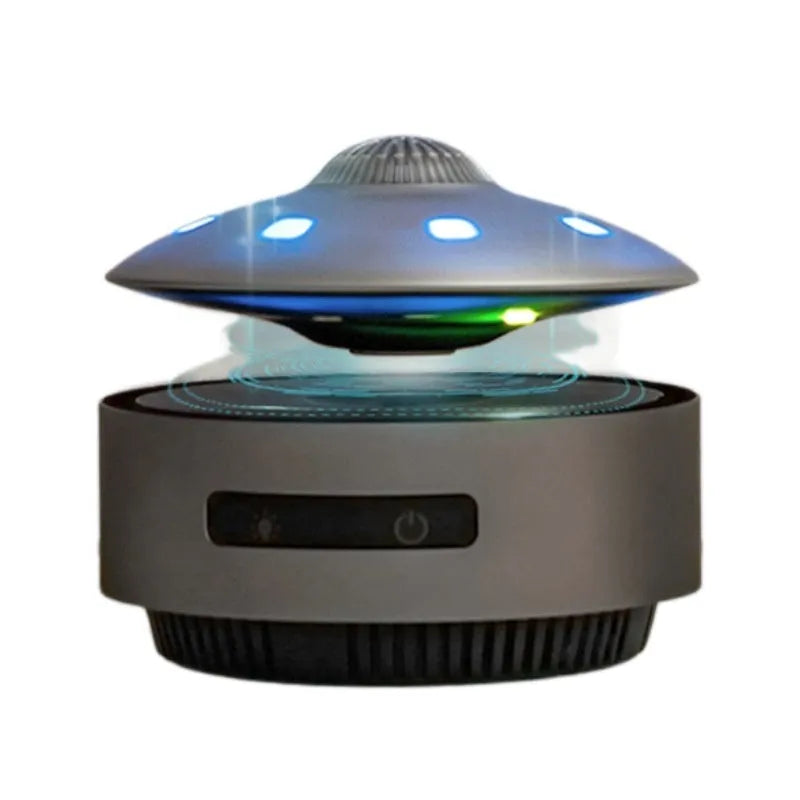Black automatic lifting magnetic levitation Bluetooth speaker floating above its base.