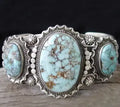 Silver ring with green agate stone in bubble eight leaf design on light background