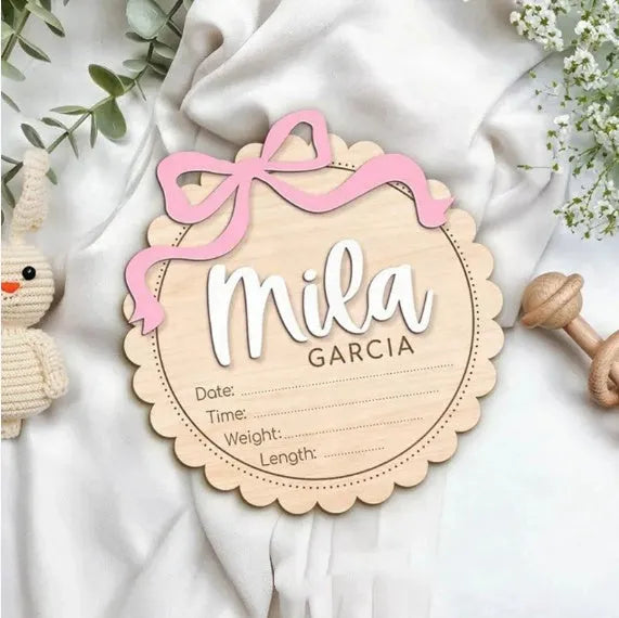 Square wooden baby room ornament with customised name engraving for nursery decor.