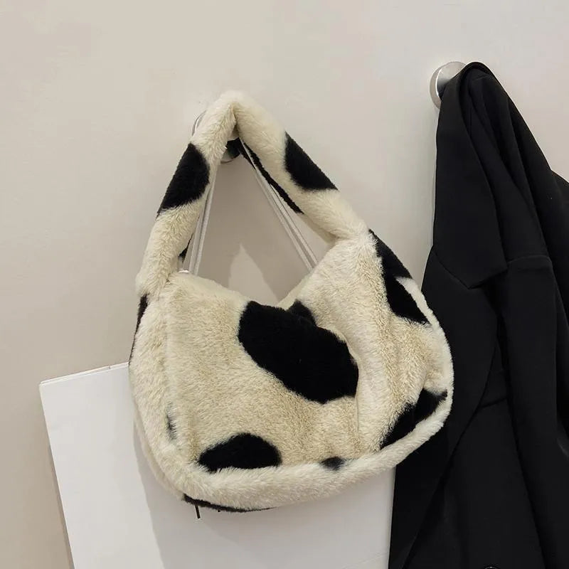 Velvet plush crossbody bag with contrast love heart detail, available in green, pink, black, and beige.