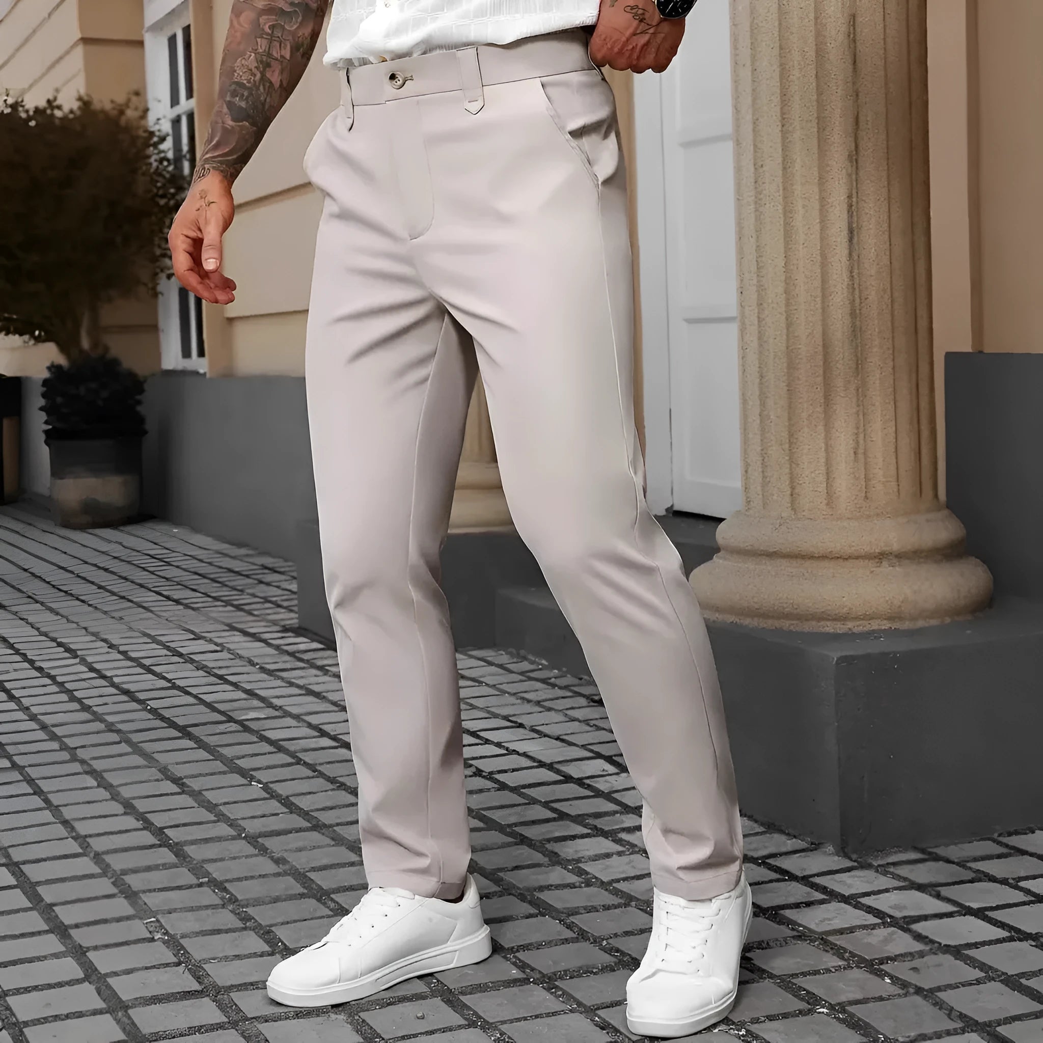 Men's straight-leg business casual trousers in apricot colour on a hanger.