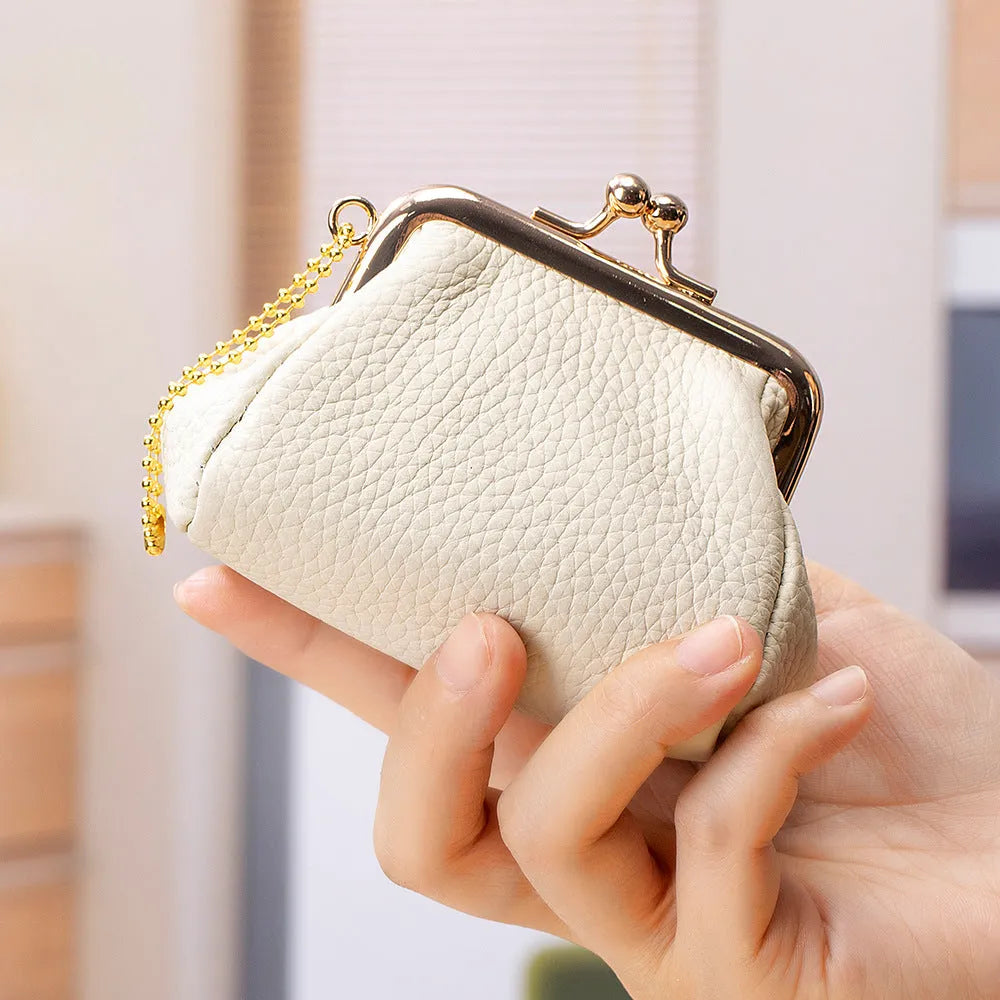 Genuine leather mini coin wallet in solid colour with visible sewing thread detail – urban simplicity design