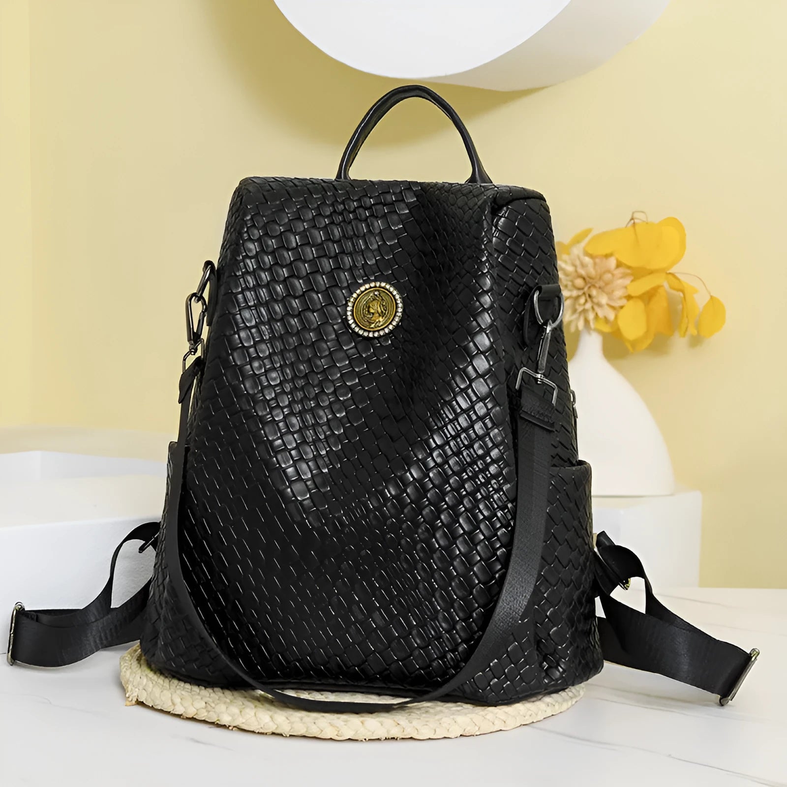 Women's black anti-theft backpack with waterproof PU material and multiple organisational compartments