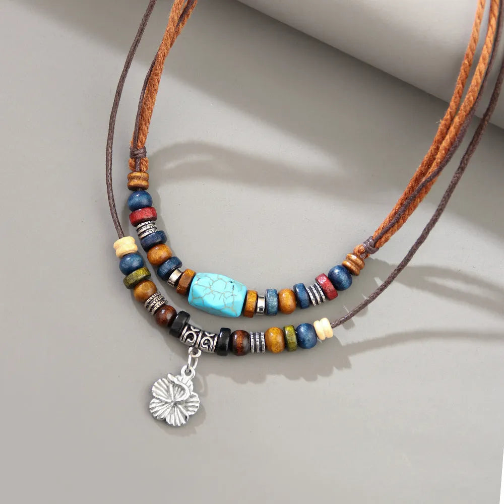 Men's wooden bead necklace with turquoise wax rope and geometric alloy pendant featuring flower details