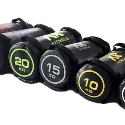 Flat white PVC fitness sandbag on gym floor, showing size and sturdy handles for weight training.