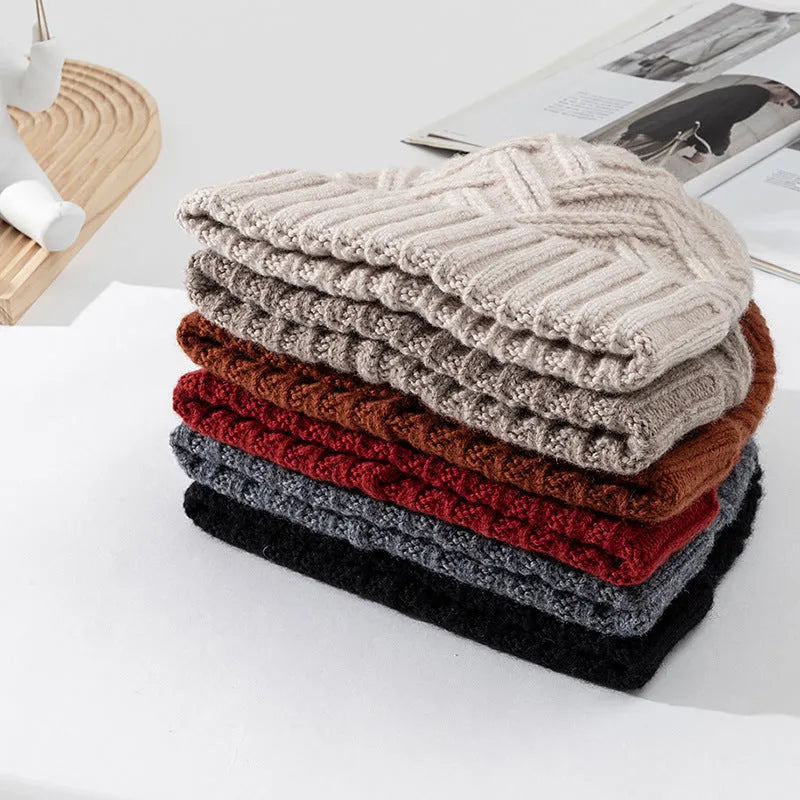 Wool knitted dome crown winter hat in assorted colours featuring a totem pattern.