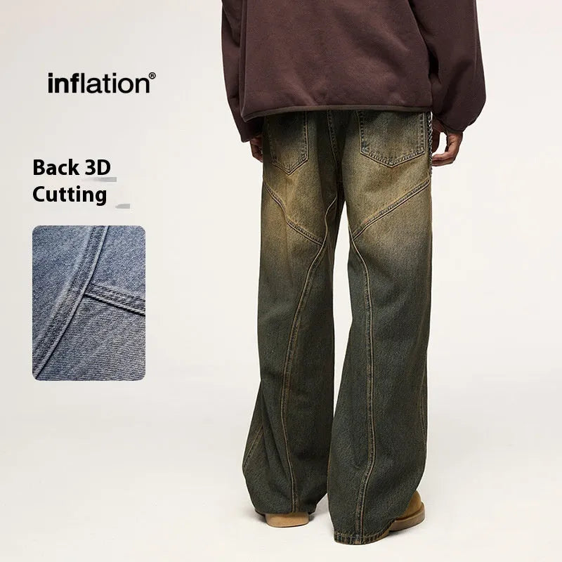 Man wearing washed blue wide leg straight-cut jeans with a mid waist and zipper fly.
