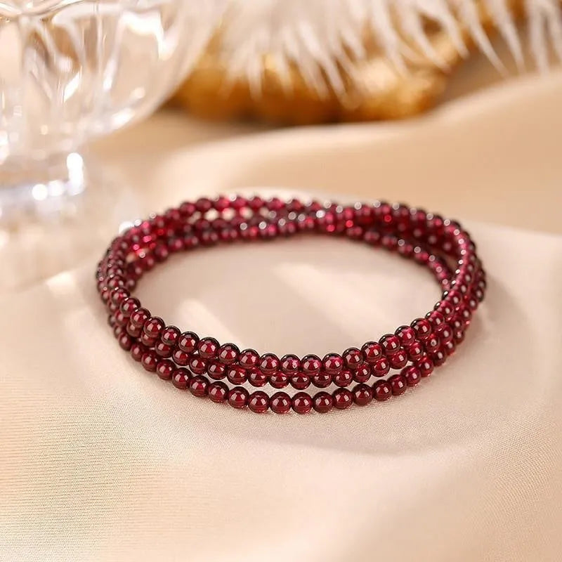 Antique style Chinese bracelet with U-shaped design and floral red garnet imitation gemstones