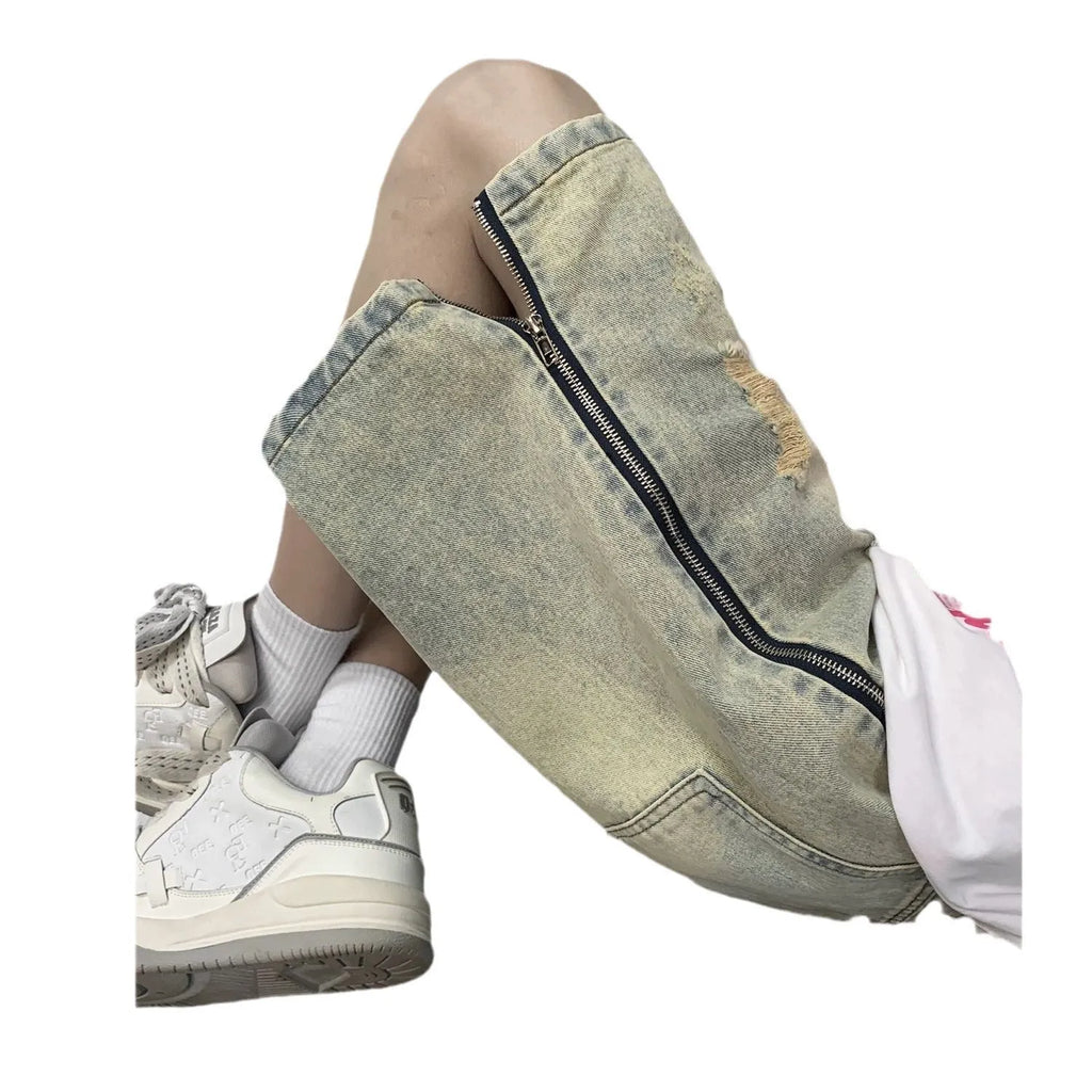 Men's blue denim shorts with yellow mud finish, ripped details, cardigan buttons, and a straight leg opening.