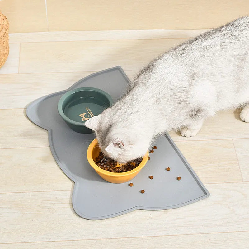 Cat head shaped silicone pet feeding mat in blue colour measuring 44cm by 24cm