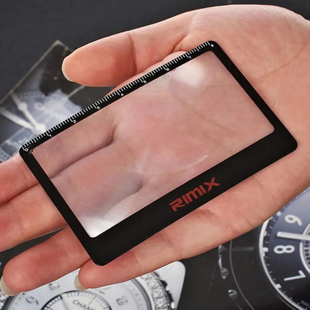 Portable plastic card magnifier for reading small text, shown in black and white colour options