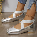 Gold slip-on evening pumps with a square toe and low heel on a plain background.