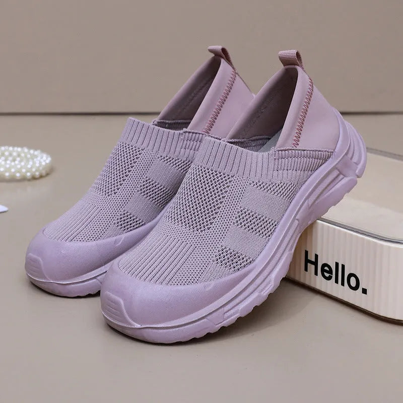 Women's black slip-on shoes with round toe design and soft PVC sole for casual wear