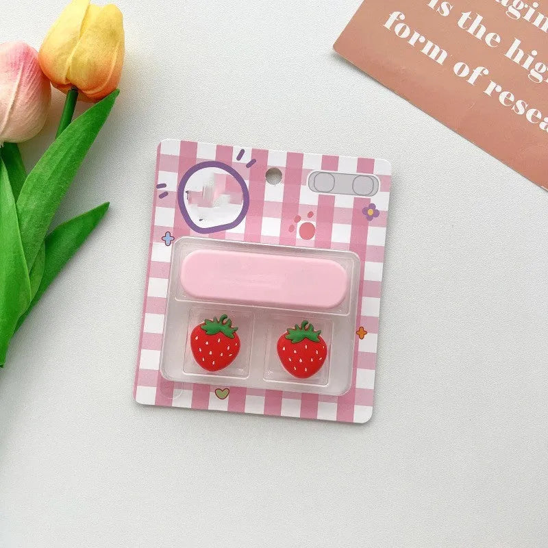 Plastic cartoon-style magnetic data cable fixer clip on a desktop