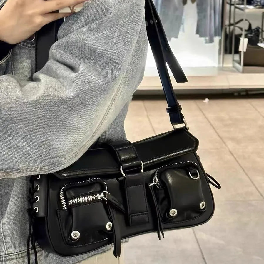 Black PU leather shoulder messenger bag showing adjustable strap and structured form