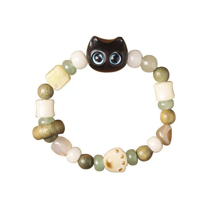 Hand-woven adjustable bracelet with bodhi seeds, jade beads, and a cartoon cat's paw guajacwood charm