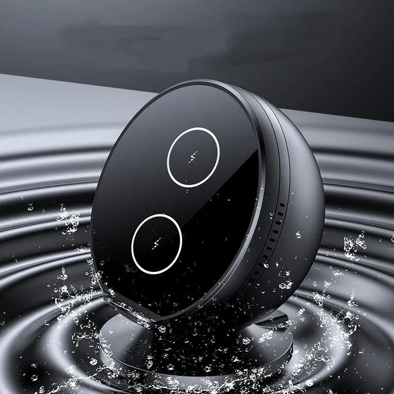 Black multifunctional wireless phone charging holder with integrated Bluetooth speaker on a desk.