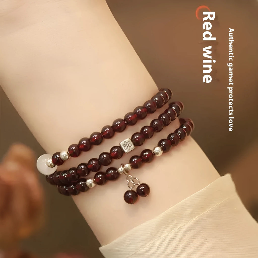 Antique style Chinese bracelet with U-shaped design and floral red garnet imitation gemstones