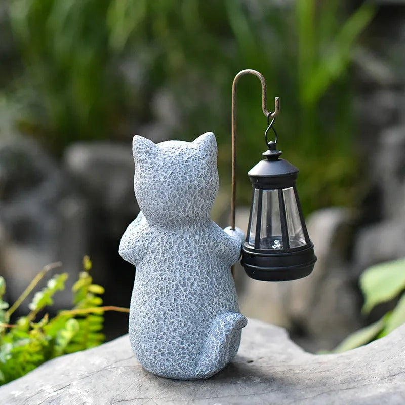 Solar-powered garden lamp with resin kitten ornament decoration for outdoor lighting