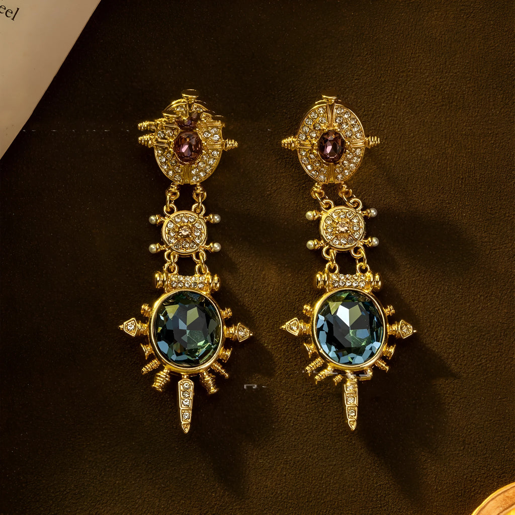 Gold geometric stud earrings with round elements and diamond treatment on alloy metal