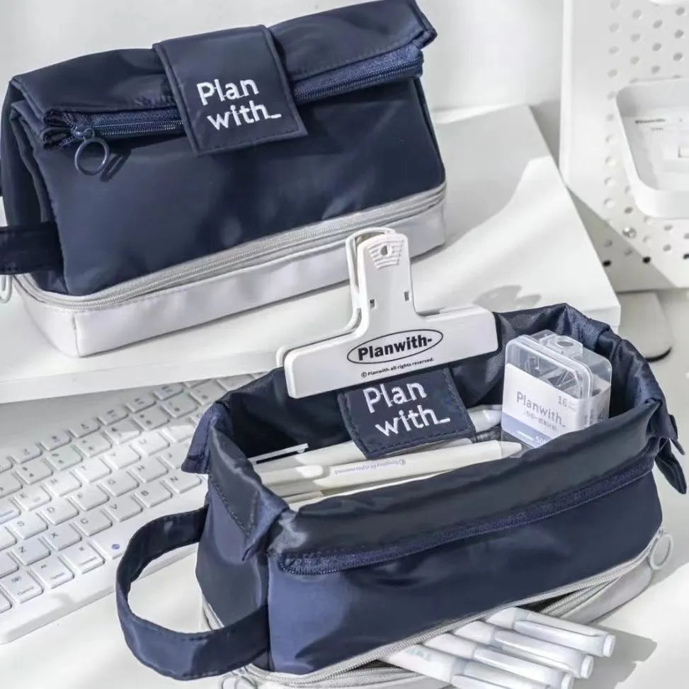 Fashion student pencil case in beige, blue, and navy blue, showing double layer open design.