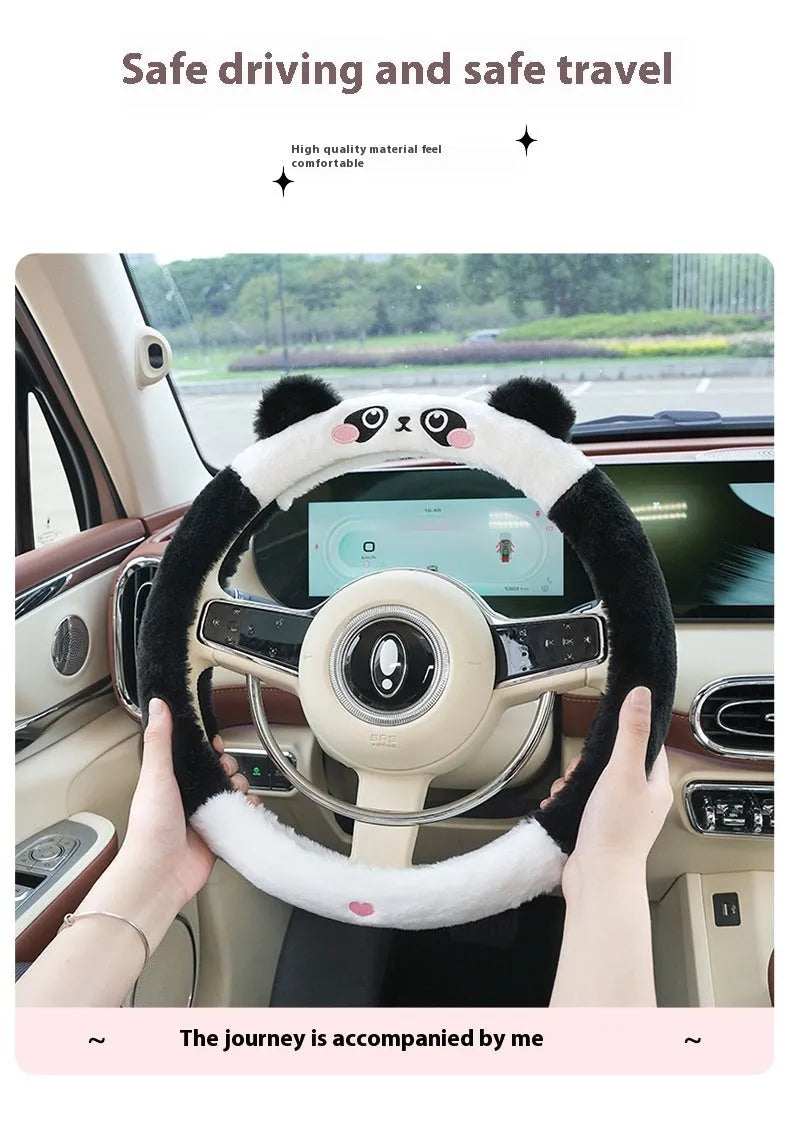 Plush cartoon animal steering wheel cover with embroidery, shown fitted on a car wheel.