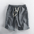 Men's striped cotton casual shorts with an elastic waistband in light blue.