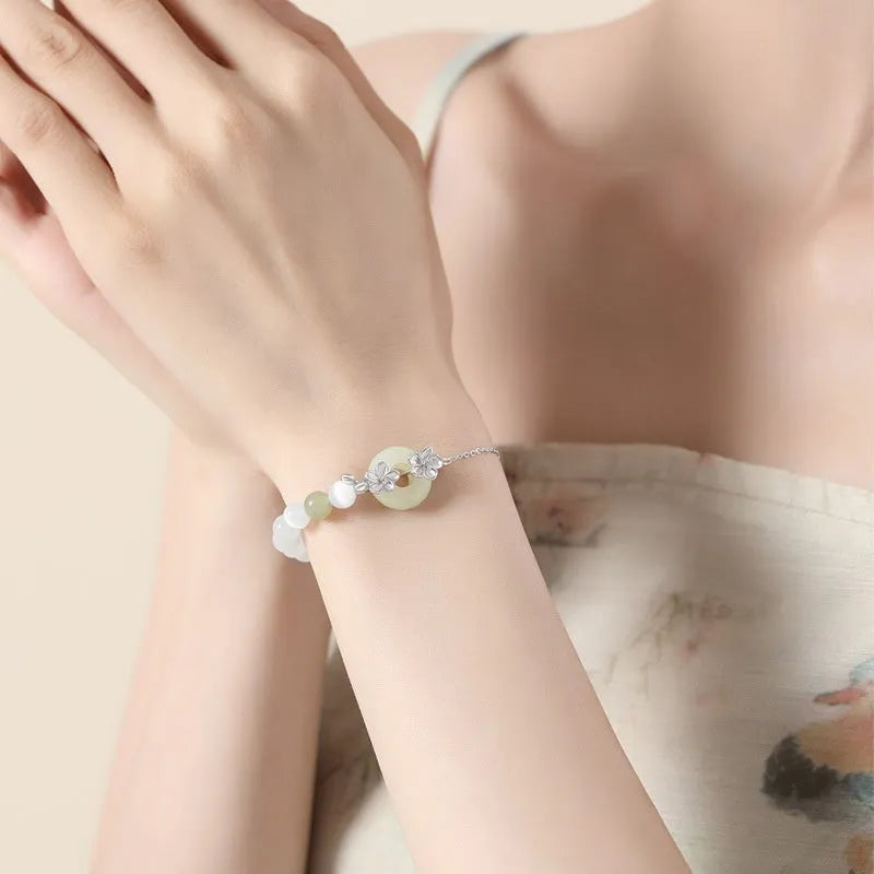Pure silver peach blossom safety buckle bracelet for women with floral design and peace buckle closure