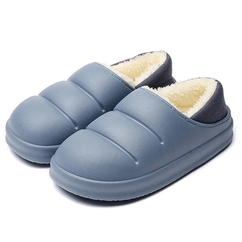 Green waterproof EVA cotton slipper with plush lining, flat sole, and hollow slip-on design.