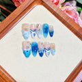 Blue hand-painted carved summer ice transparent plastic fake nails showing size range XS to L