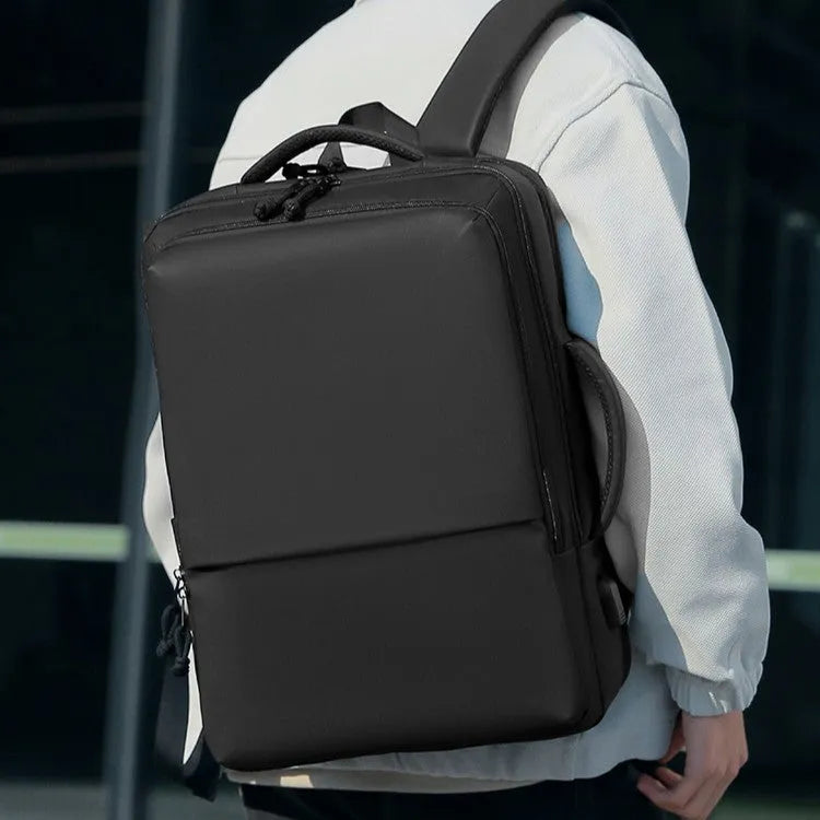Green waterproof Oxford cloth backpack for business travel with air pillow straps, 45cm tall.