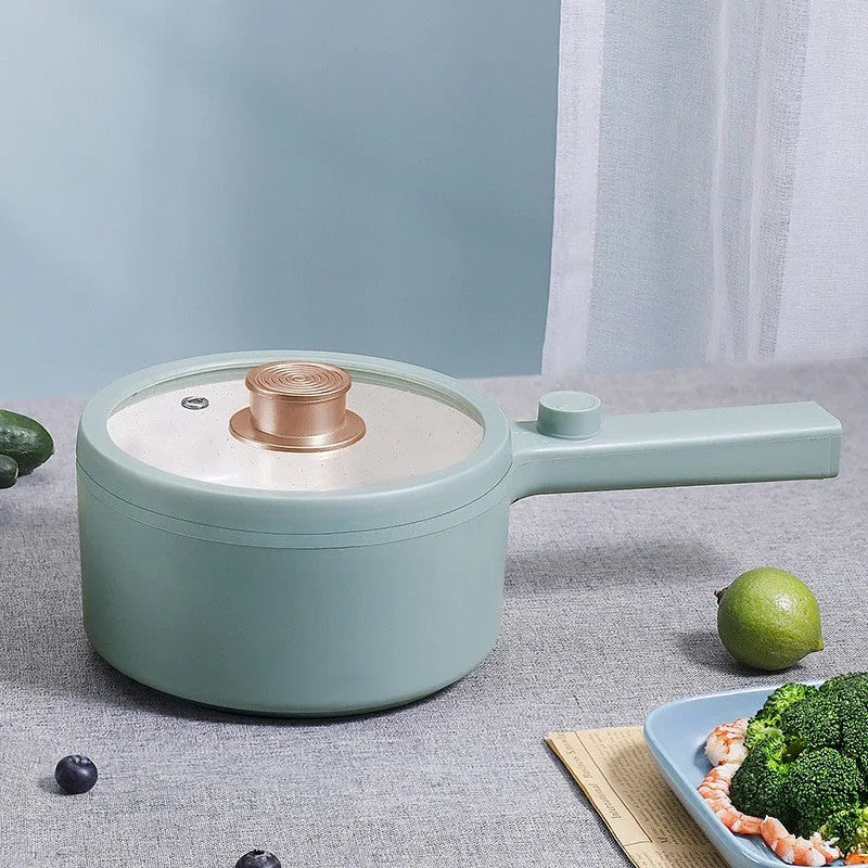White and green portable electric cooking pot with multi-function controls and international plug