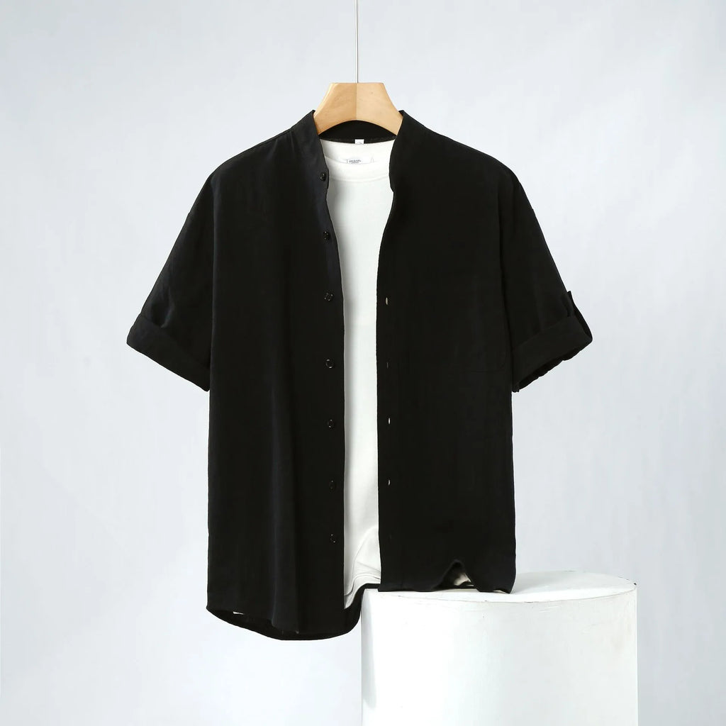 Men's loose-fit short-sleeve linen shirt in a solid colour with a stand collar.