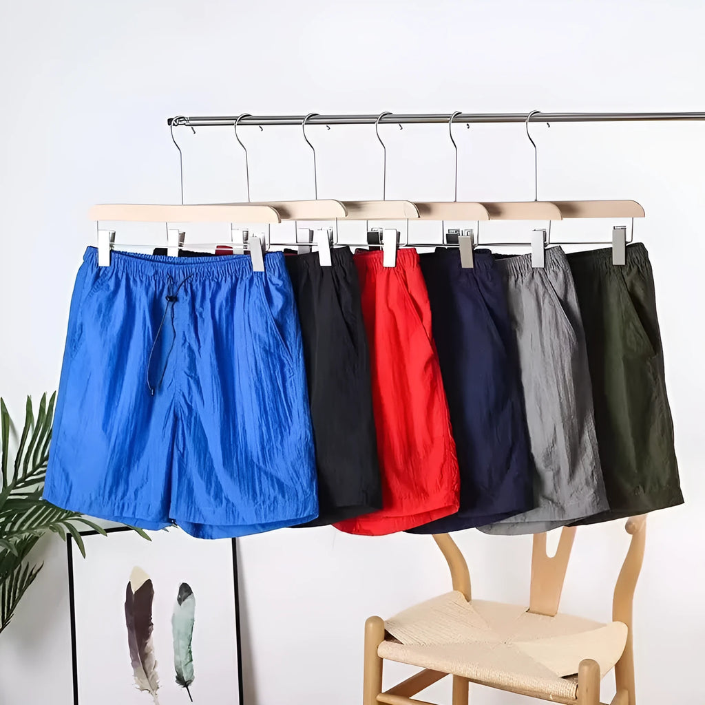Men's thin quick-drying polyester sports shorts in straight leg style, shown in army green colour.