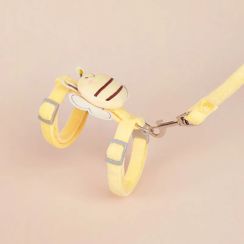 Pink adjustable bee-shaped cat leash with a teddy texture handle for outdoor walks.