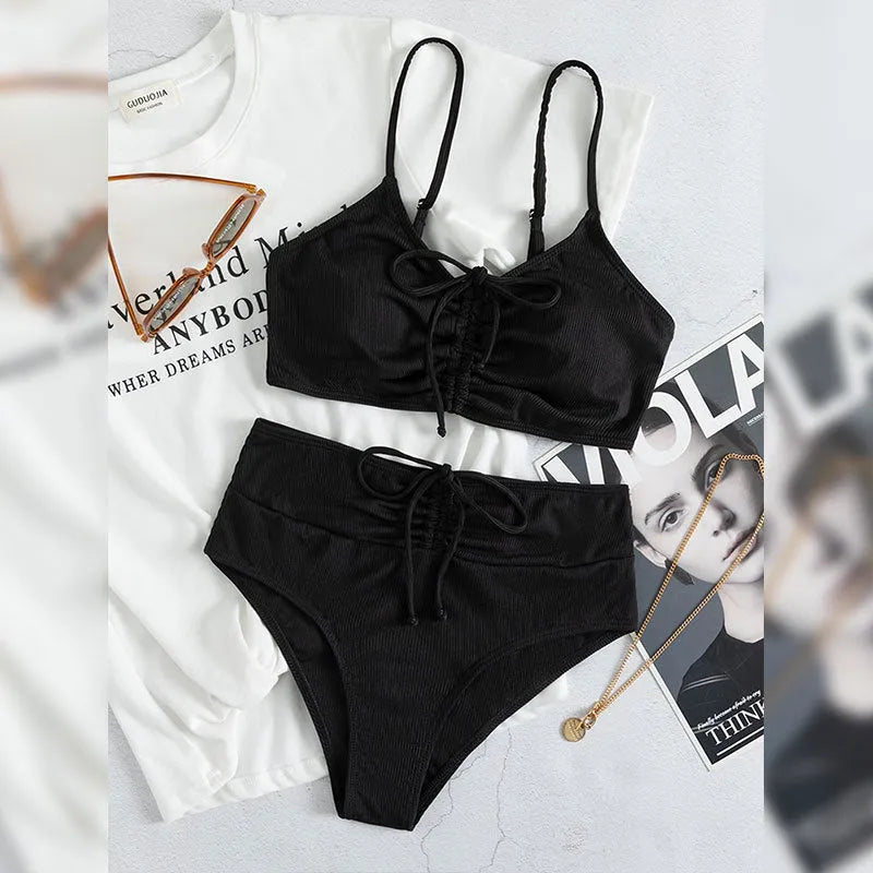Black women's high waist sling split bikini swimsuit with sleeveless top and shorts