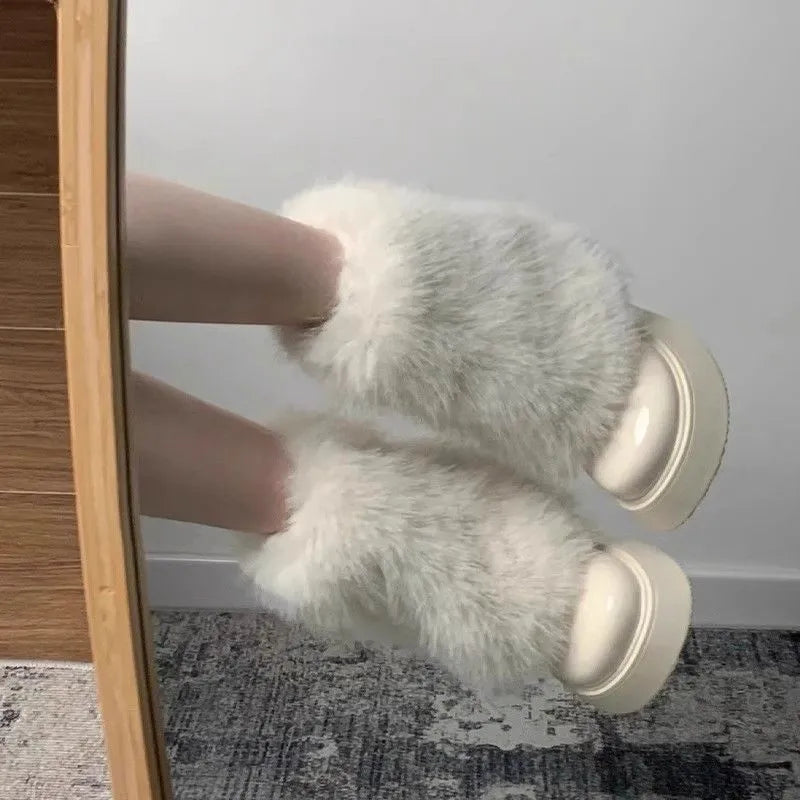 Women's black artificial plush snow boots with a waterproof rubber sole and fleece lining.