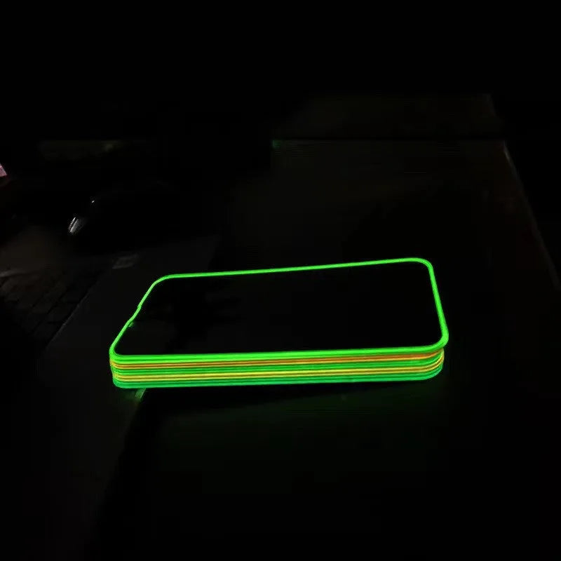 Fluorescent tempered glass screen protector for iPhone with glowing green edge on a phone