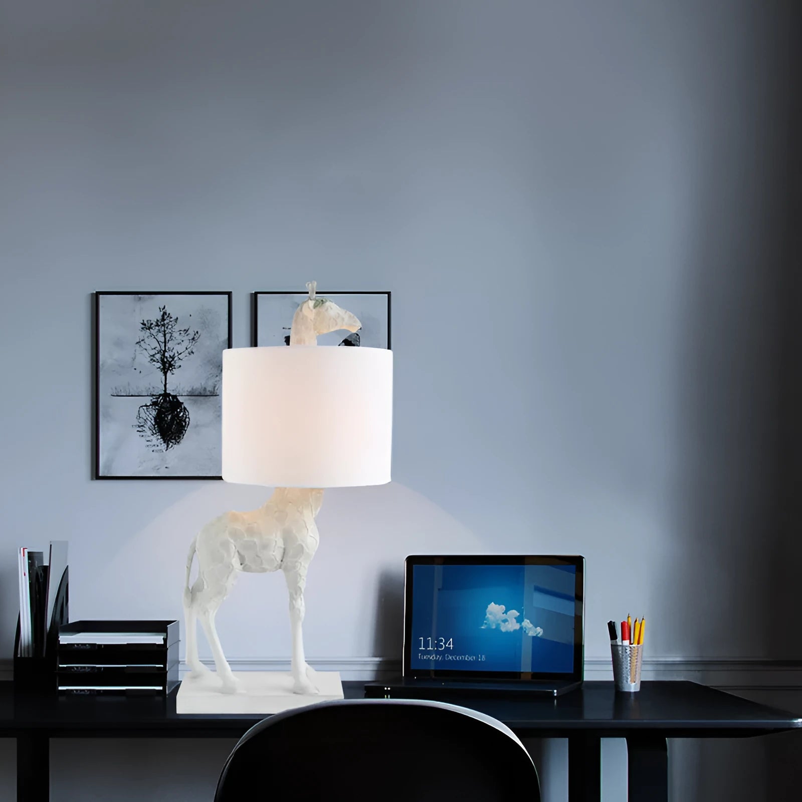 White giraffe table lamp with cloth shade on wooden bedside table
