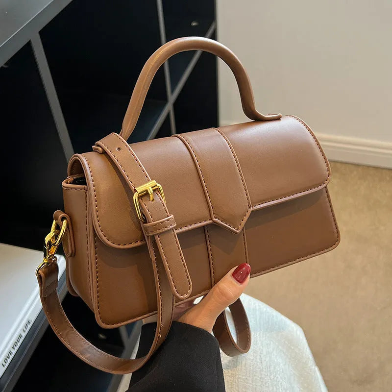 Women's beige messenger bag showing file compartment and sandwich pocket exterior