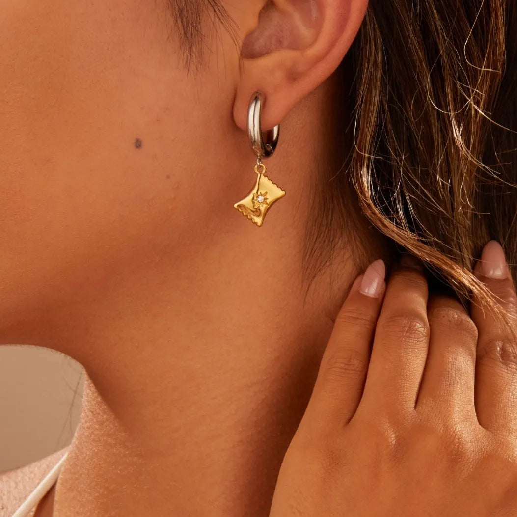 Women's stainless steel earrings with 18K gold plating in heart, star, and Christmas tree shapes.