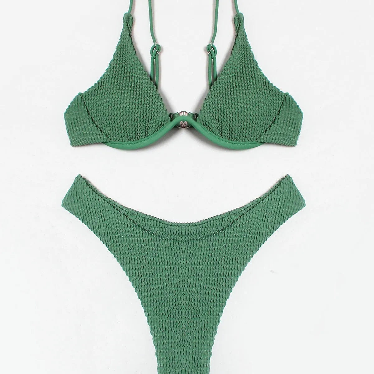 Women's solid green bikini suit with ruffle trim and split leg briefs on a mannequin.