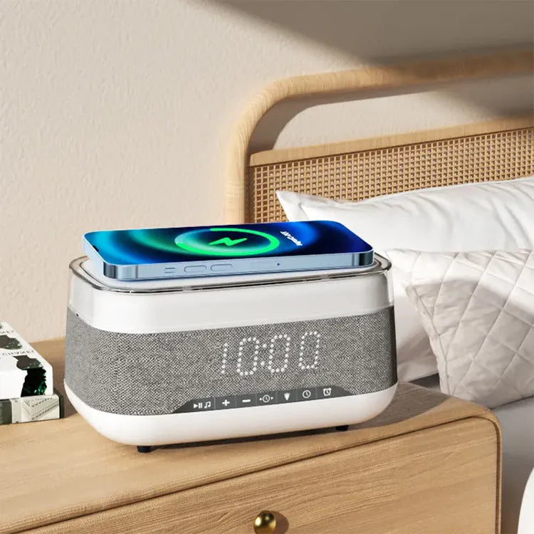 White multifunctional alarm clock with Bluetooth speaker, wireless charging pad, and night light.