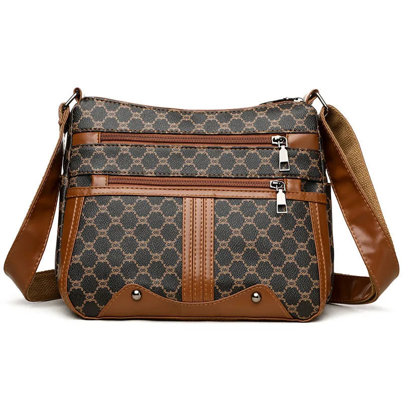 Brown women's crossbody bag with textured stitching pattern and adjustable strap showing interior polyester lining