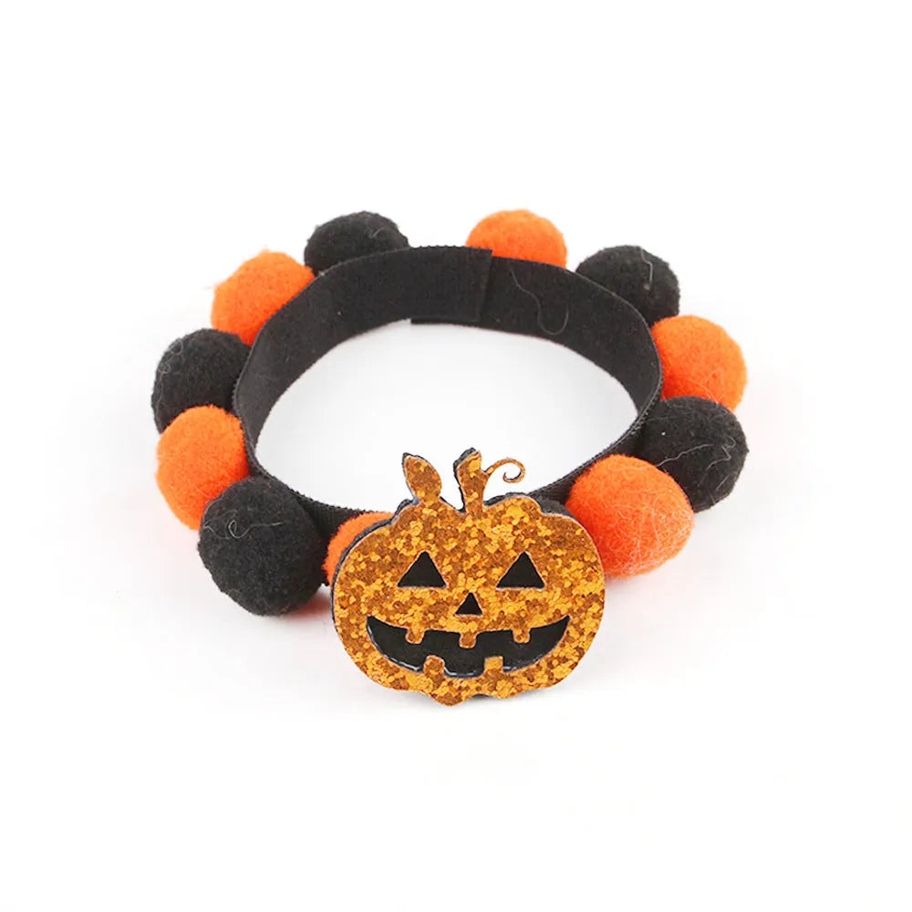 Halloween pet collar with a fur ball decoration in a pumpkin design, shown in size M.