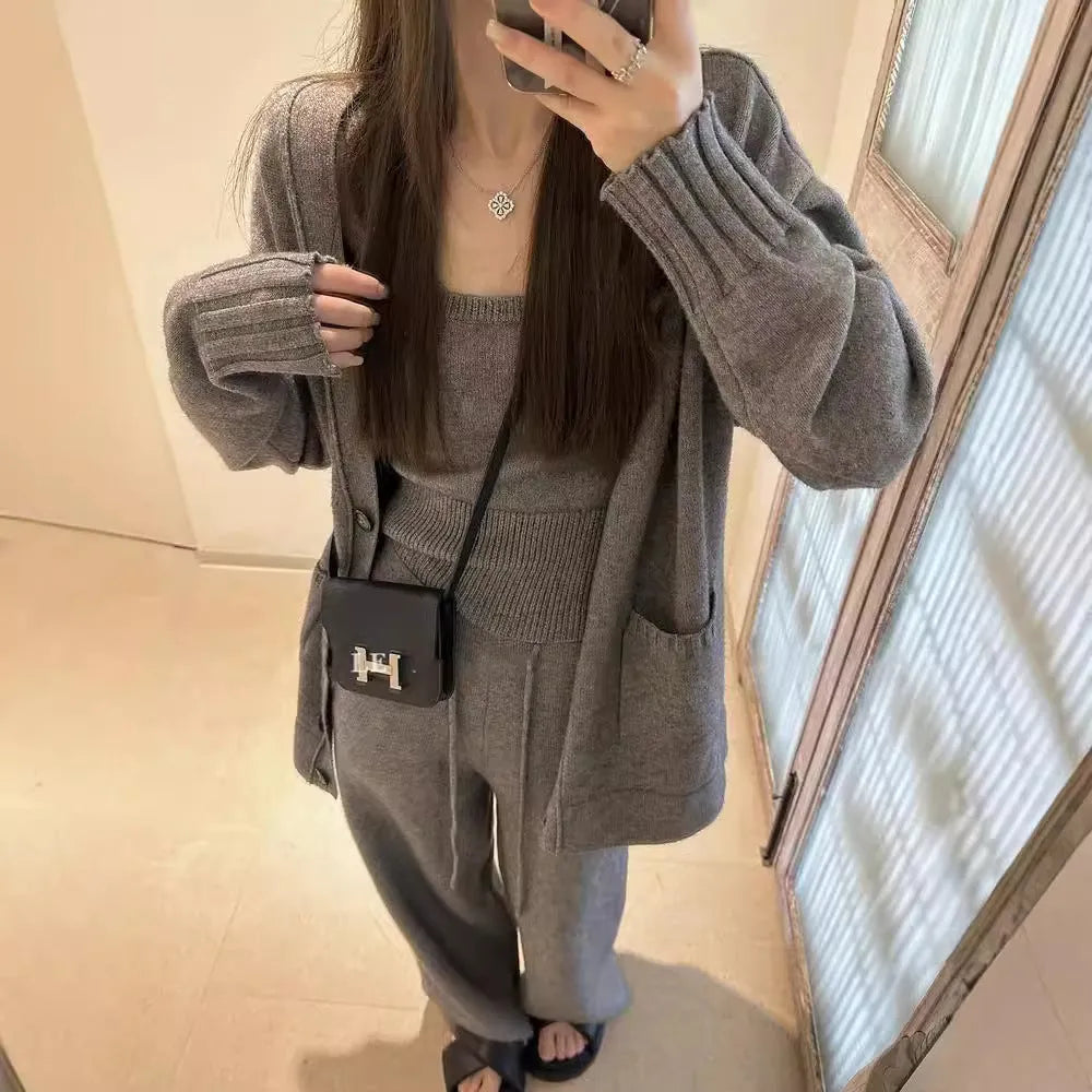 Women's knit three-piece set with cardigan, vest, and suspender pants in wool blend fabric