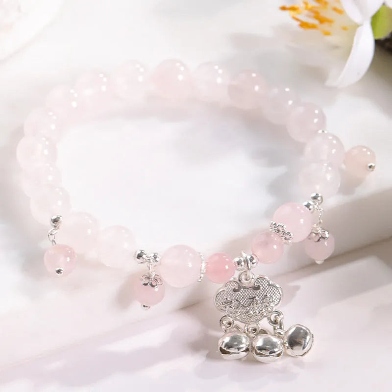 Close-up of electroplated opal cat's eye beaded bracelet for women with diamond-shaped charm