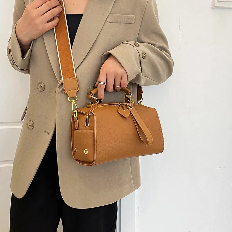 PU leather shoulder messenger bag with outer slit pocket and crossbody strap in black colour