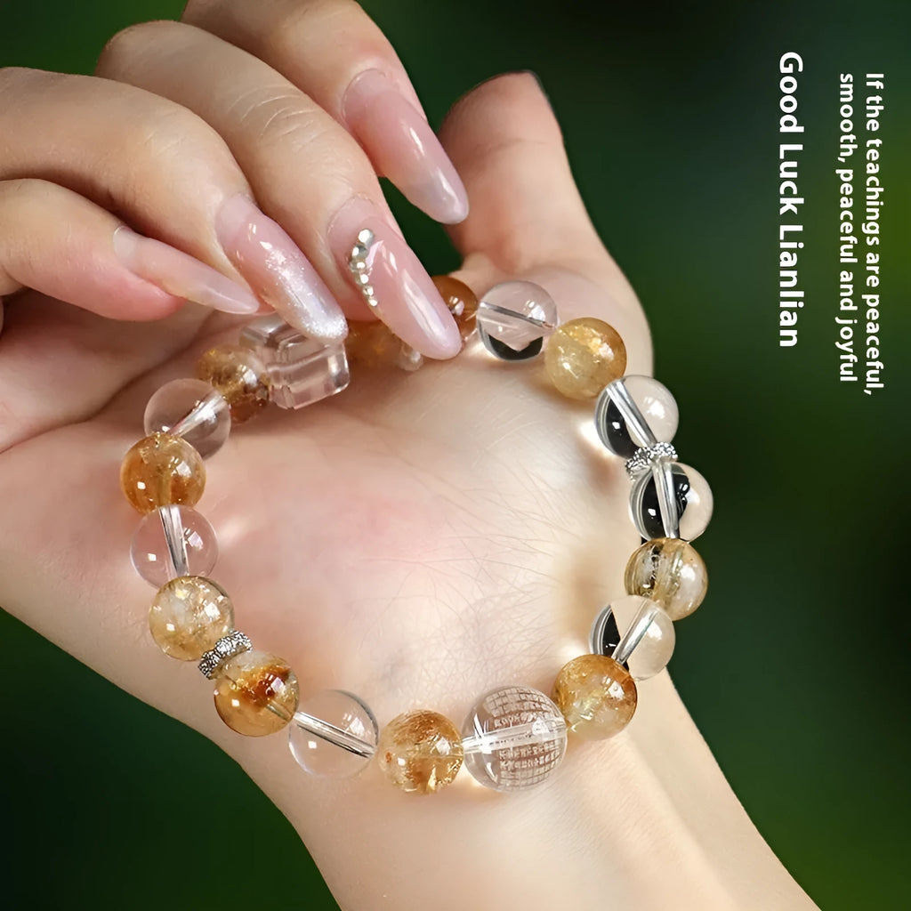 Handmade Huang Tajing beaded bracelet with freshwater pearl, yellow crystal, and white crystal beads